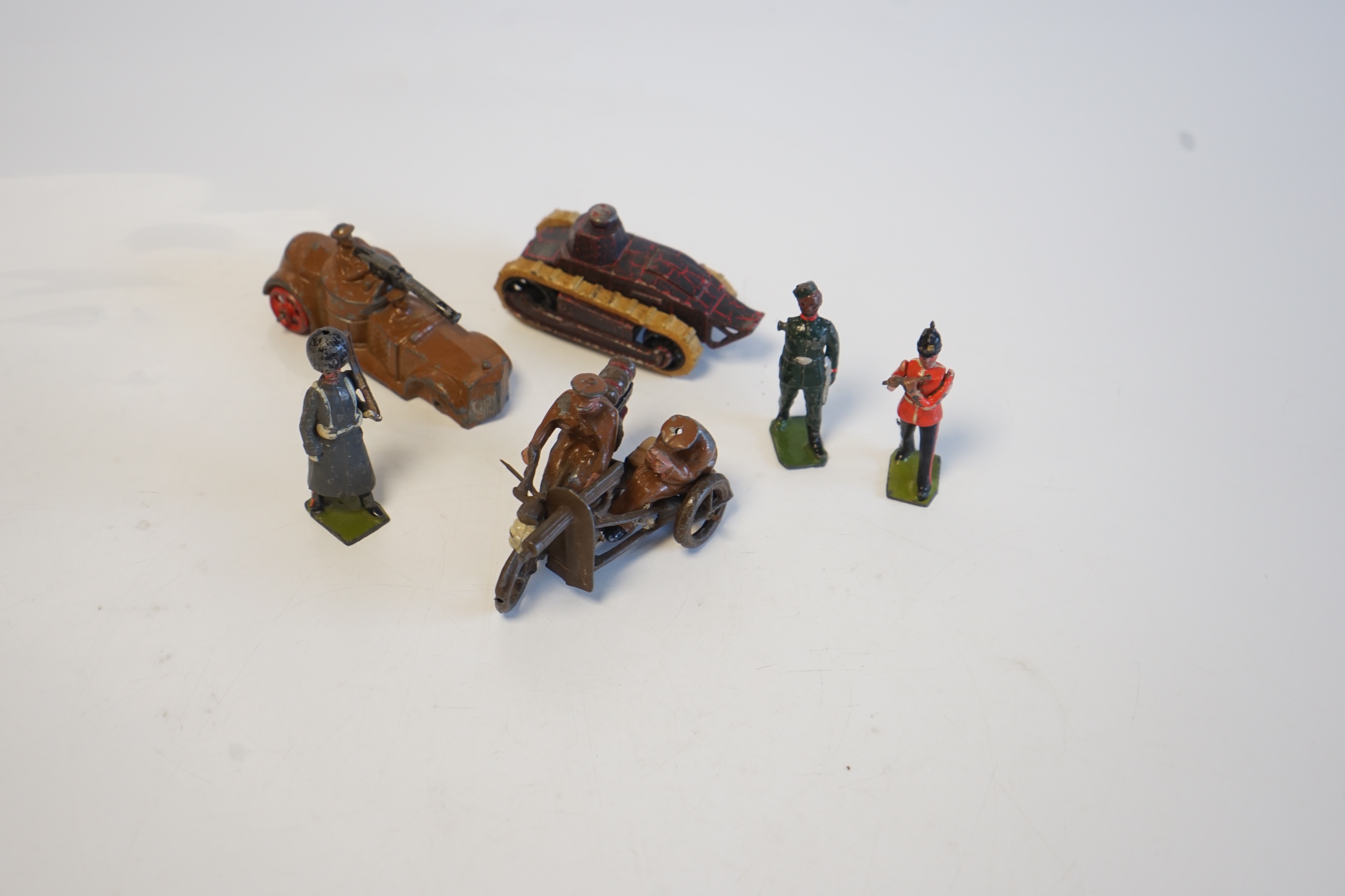 A collection of approximately seventy early lead soldiers by Britains including; four British Expeditionary Force Machine Gunners (from set 194), three Motorcycle Machine Gun Combinations (from set 199), four other machi